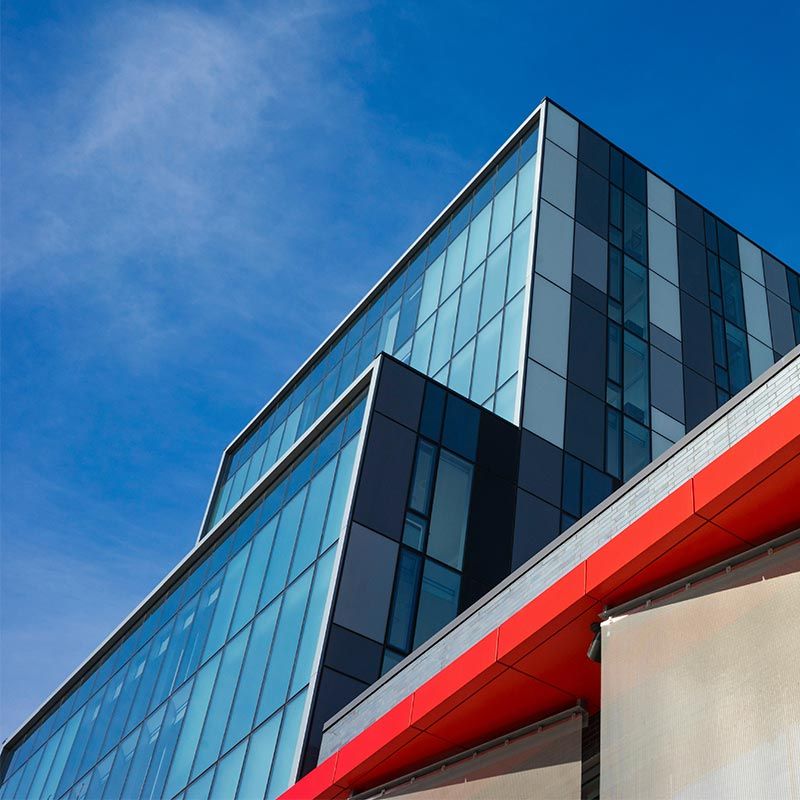 Modern glass office building with specialty window film