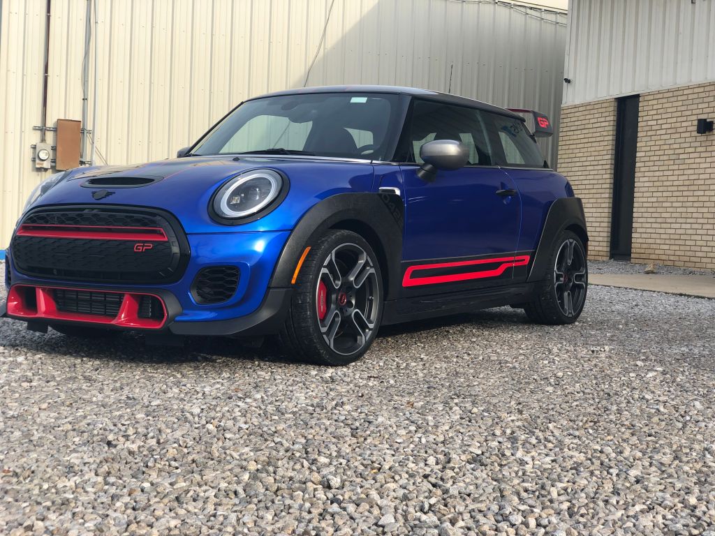 Blue Mini Cooper with red racing stripes.