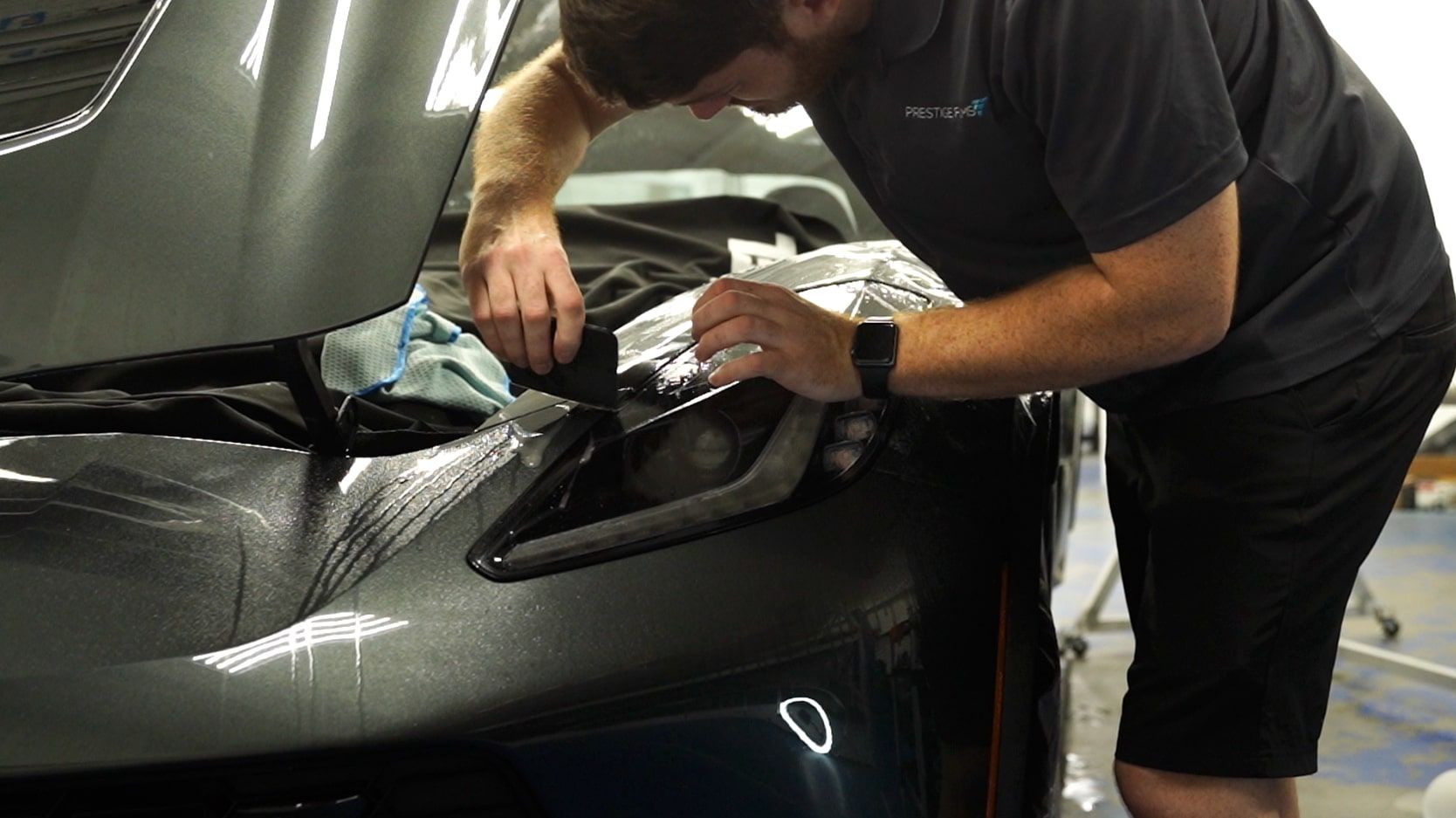 PPF Corvette-min - Prestige Films Installer applying Xpel paint protection film to a Corvette at Prestige Films