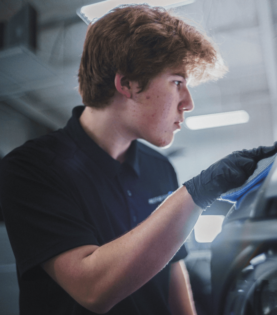 A detailer installing ceramic coating in Lafayette La.