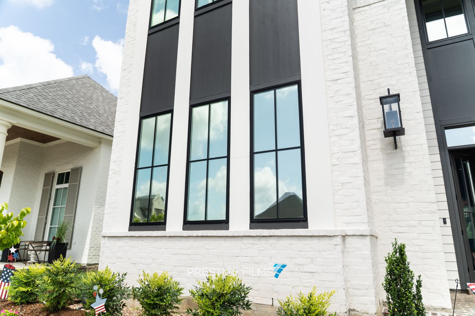 Home exterior with XPEL VISION window film on the windows
