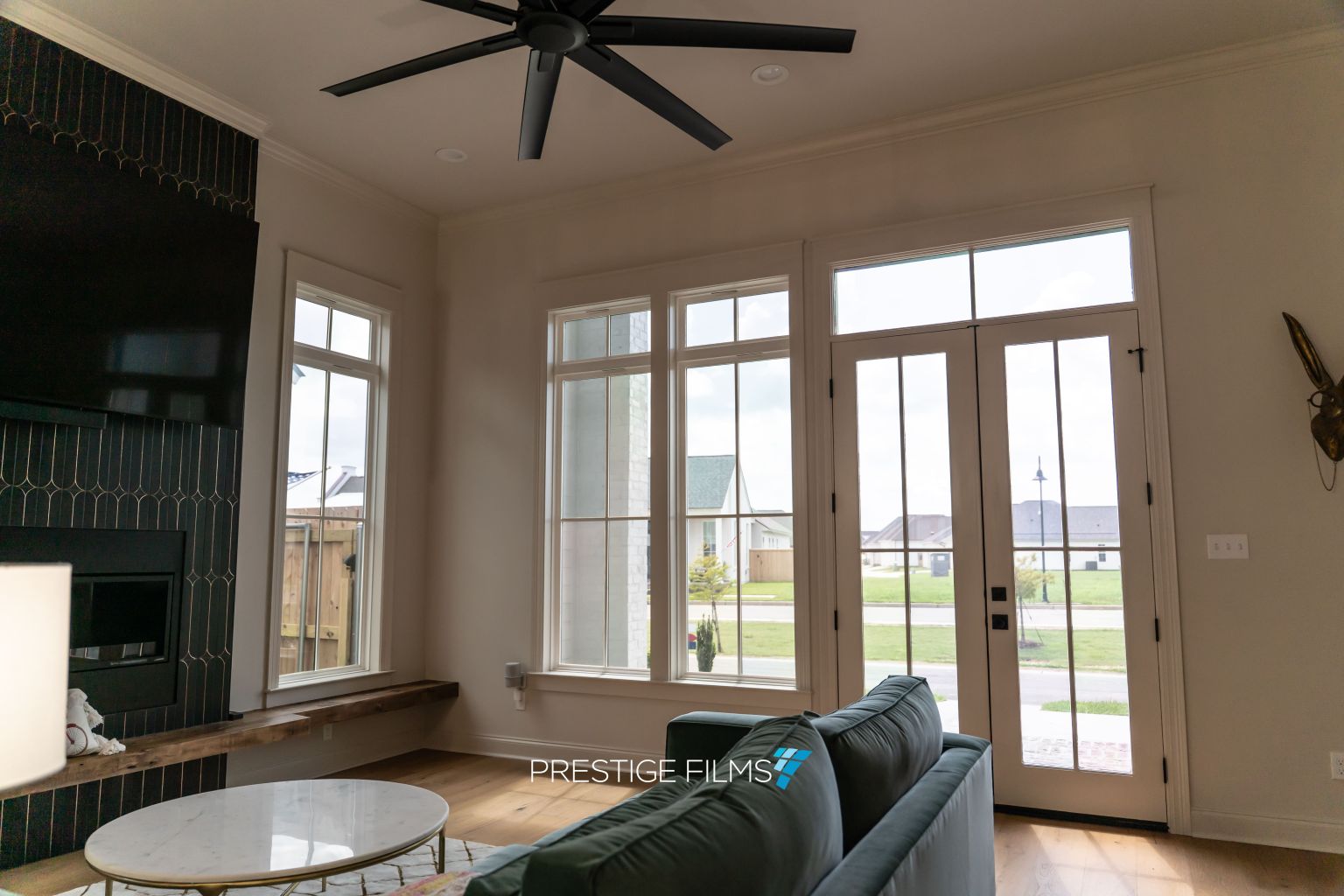 Living room with XPEL VISION window film on the windows and patio doors