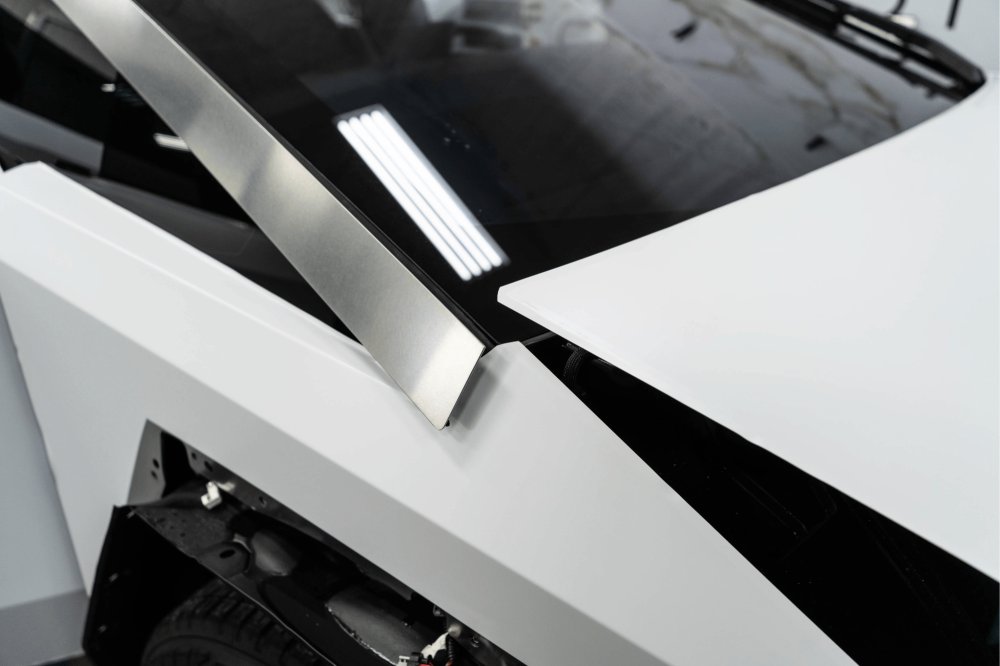 Close-up of white color paint protection film on a body panel