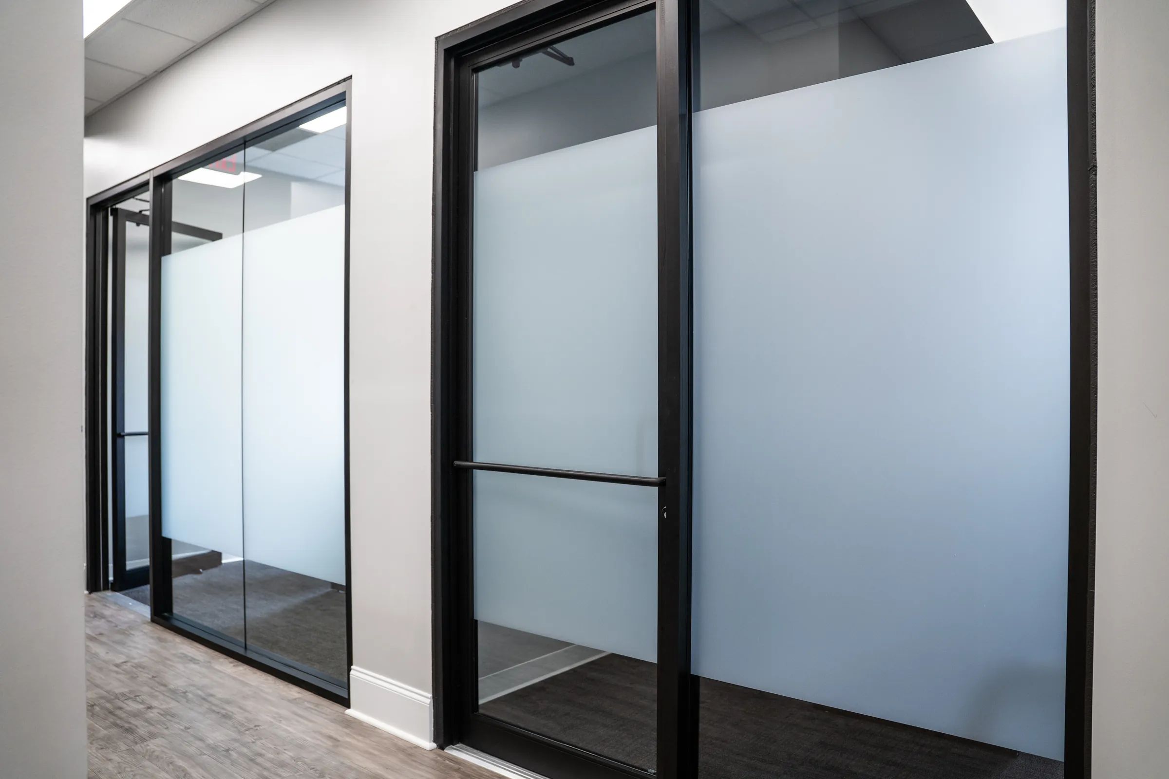 Office glass door and wall with XPEL VISION White Frost window film for privacy