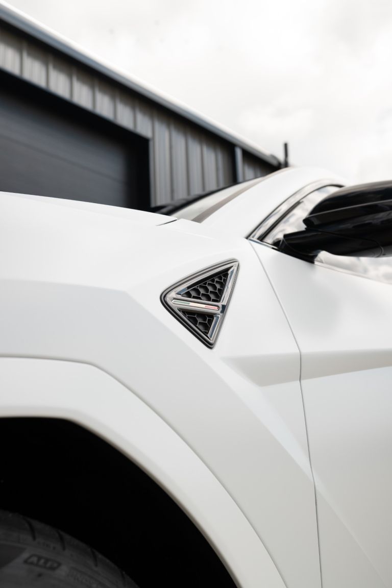 Front fender vent on a white Lamborghini Urus with paint protection film
